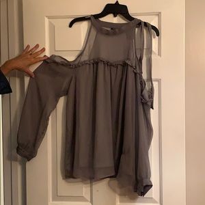 Ladies shear open shoulder blouse.
